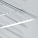 A white shelf inside an Avantco countertop display refrigerator.