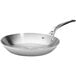 A de Buyer stainless steel fry pan with a handle.