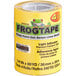 A white roll of FrogTape for delicate surfaces with yellow packaging featuring a green frog.