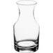 A clear glass Acopa bud vase with a curved neck.