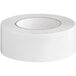 A roll of white Duck Tape for carpet on a white background.