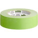 A roll of green FrogTape with a green and black label.