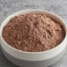 A white bowl of Gold Medal chocolate brownie mix powder.