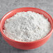 A bowl of Gold Medal biscuit mix in front of a white background.