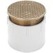 A white plastic pipe with a round lid and a gold square pattern.