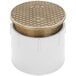 A white plastic pipe with a round metal lid and a gold square pattern.
