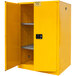 A yellow metal safety cabinet with manual doors and shelves.