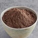 A bowl of Pillsbury Bakers' Plus Dark Devil's Food Cake Mix powder.