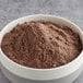 A bowl of Pillsbury Bakers' Plus Double Dark Chocolate Cake Mix powder.