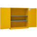 A yellow metal Durham Mfg flammable storage cabinet with shelves.