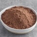 A white bowl of Gold Medal chocolate cake mix.