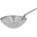 A silver de Buyer carbon steel wok with a handle.