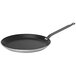 A black and silver de Buyer Choc Resto Induction crepe pan with a handle.