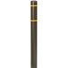 An Innoplast brown bollard cover with a yellow reflective stripe over a metal pole.