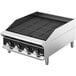 A Vollrath stainless steel charbroiler with knobs on a counter.