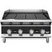 A stainless steel Vollrath Cayenne charbroiler on a counter with knobs and dials.