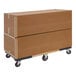 A Vestil utility dolly with two cardboard boxes on the carpeted deck.