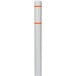A white bollard cover with orange reflective stripes over a white bollard.