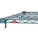 A Metroseal wire shelf for a Metro Super Erecta rack with a red label.