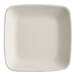 A natural bagasse square appetizer plate with a white background.