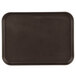 A black rectangular Cambro non-skid serving tray with a Tavern Tan finish.