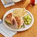 A sandwich on an EcoChoice bagasse 3 compartment plate.
