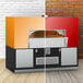 A multicolored rectangular Wood Stone stone hearth pizza oven.