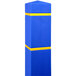 A blue rectangular bollard cover with yellow reflective stripes.