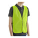 A person wearing a yellow Lavex safety vest.
