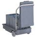 A grey cart with a large container on it.