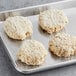 A tray of Mind Blown plant-based vegan crab cakes on a gray surface.