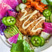 A plate with a Mind Blown Plant-Based Vegan Crab Cake and vegetables.