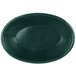 A green oval polyethylene basket with a weave pattern on a table.