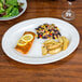 A CAC Porcelain Platter with salmon, potatoes, and salad on it.