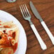 A plate of pasta with a WNA Comet ivory plastic fork.