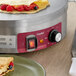 A pastry on a crepe maker with fruit.