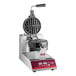 A white Estella commercial waffle maker with a red and black round waffle maker.