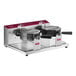 A white Estella commercial double Belgian waffle maker with two round black handles.
