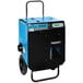 A blue and black Dri-Eaz DriTech 4000i desiccant dehumidifier with wheels and a blue handle.