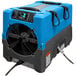 A blue and grey Dri-Eaz Revolution LGR dehumidifier with a fan.