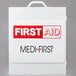 A white Medique first aid kit cabinet with red and black text.