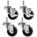 A set of 4 True swivel stem casters with black rubber wheels.