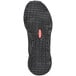 The black sole of a Skechers Work Jake men's athletic shoe.