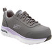 A grey Skechers athletic shoe with a purple and white sole.