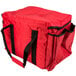 A red Rubbermaid insulated sandwich delivery bag with black straps.