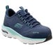 A close-up of a navy blue and aqua Skechers Work Sadie athletic shoe with alloy toe.