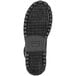 The sole of a Timberland Pro black leather boot with rubber tread.