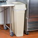 A beige Continental rectangular wall hugger trash can.