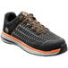 A black and orange Timberland PRO Powerdrive men's work safety shoe with a composite toe.