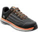 A black and orange Timberland men's composite toe athletic shoe.